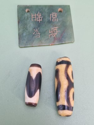 Lot 1412 - A Chinese spinach green rectangular pendant...