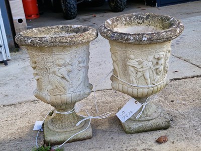 Lot 942 - Four stone garden urns (with bases) with...