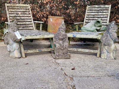 Lot 945 - Three stone gnome figures, one sitting and two...