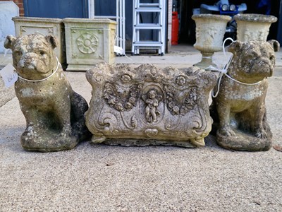 Lot 949 - A pair of stone dog figures (Staffordshire...