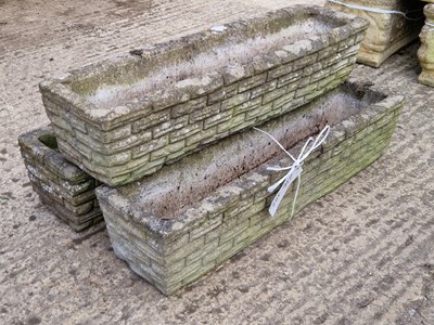 Lot 957 - Two medium stone troughs with a brick and...