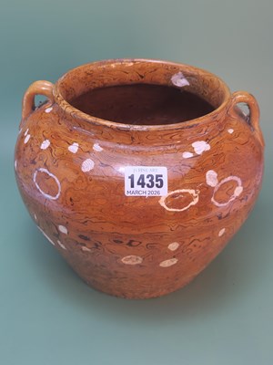 Lot 1435 - A Chinese ochre agate ware jar with two lug...