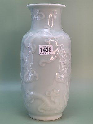 Lot 1438 - A Chinese pale celadon vase moulded in relief...