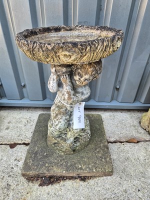 Lot 969 - A stone cast cherub bird bath 
H 65cm W 45cm D...