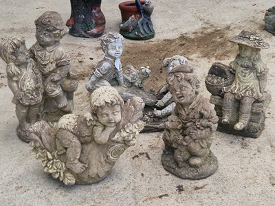 Lot 972 - A set of 5 garden ornaments depicting children...