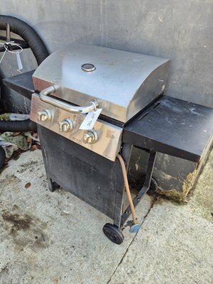 Lot 975 - A brushed stainless steel gas BBQ with 3...