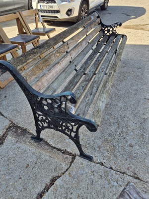 Lot 976 - A cast iron and wooden bench in a Victorian...