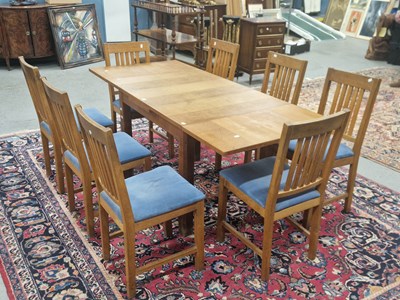 Lot 1448 - A Heal's oak draw leaf dining table and a set...