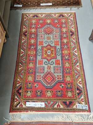 Lot 1457 - An Oriental rug of Kazak design 160 × 90cm
