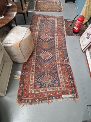 Lot 1461 - An antique Caucasian tribal runner 270 × 110cm