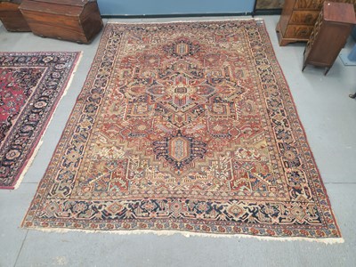 Lot 1488 - An antique Persian Heriz carpet 400 × 310cm
