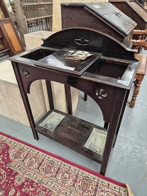 Lot 215 - An early 20th-century oak stickstand H 89 W 70...