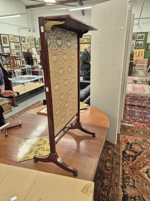 Lot 228 - An early 19th century firescreen with a rising...