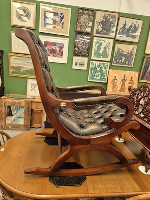 Lot 238 - A button leather upholstered rocking chair