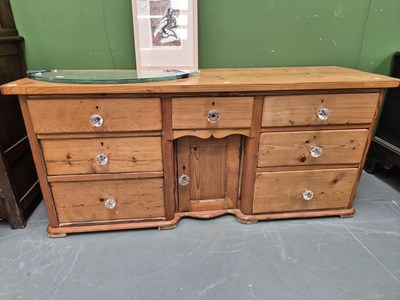 Lot 244 - A Victorian pine dresser base with seven...