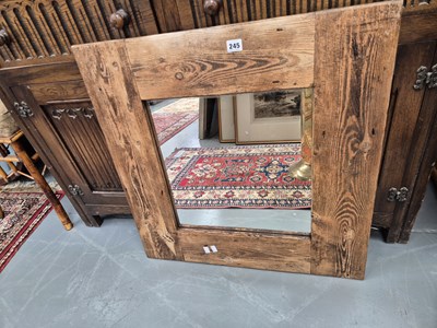 Lot 245 - A rustic pine-framed mirror