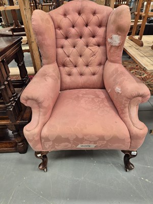 Lot 274 - An antique wing back armchair