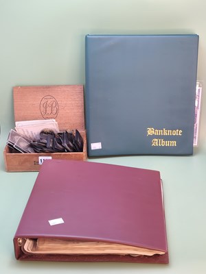 Lot 1188 - Coins and banknotes; an album containing world...