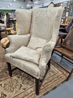 Lot 315 - An antique wing back armchair