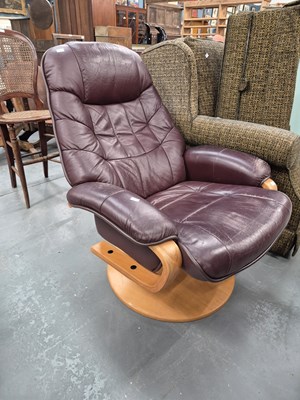Lot 317 - A modern leather swivel chair