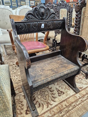 Lot 352 - A 19th century carved oak hall chair