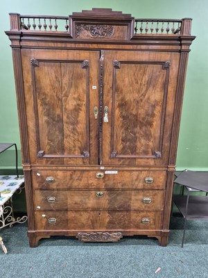 Lot 385 - An early 19th-century flame mahogany linen press