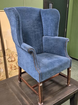 Lot 389 - A 19th century wing back armchair