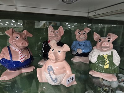 Lot 438 - A set of five Wade ceramic pigs