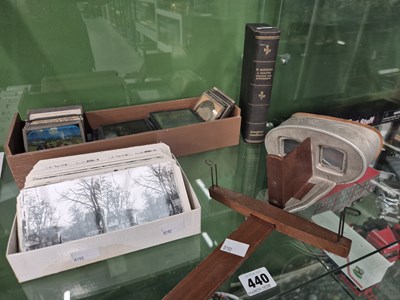 Lot 440 - A stereoscopic viewer with numerous slides,...