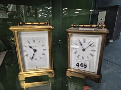 Lot 445 - Two early 20th-century brass-cased carriage...