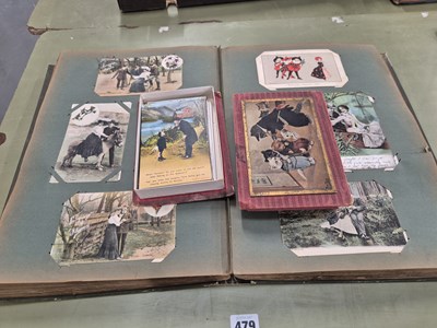 Lot 479 - A good antique postcard album including...