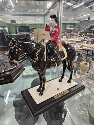 Lot 500 - A Coalport figure of Queen Elizabeth II on...