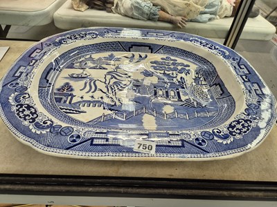Lot 750 - A large blue and white 'Willow' pattern meat...