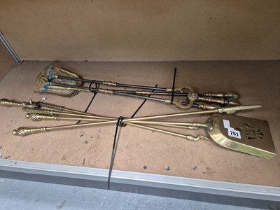 Lot 751 - Two sets of brass fire irons