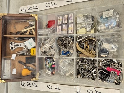 Lot 753 - A box of watchmaker's tools and strap fittings