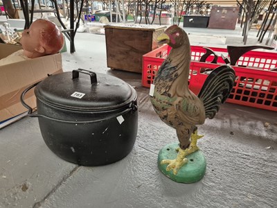 Lot 783 - An iron-lidded cooking pot and a cockerel figure