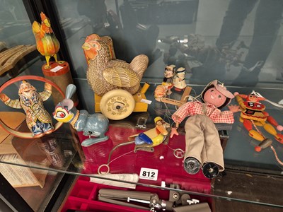 Lot 812 - Clockwork tinplate toys, two puppets, etc.