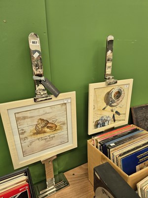 Lot 857 - A pair of chrome easel display stands