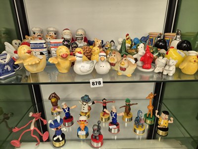 Lot 878 - A collection of novelty cruets and twelve push-...