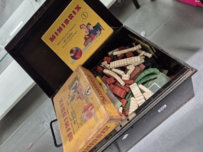 Lot 891 - A tin deed box containing Minibrix building toys