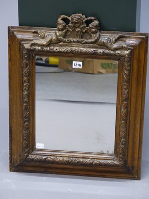 Lot 1216 - An 18th-century frame crested with a basket of...