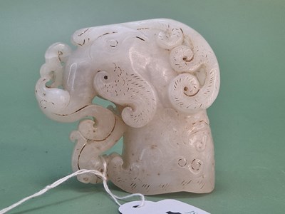 Lot 1247 - A Chinese pierced and carved white stone...