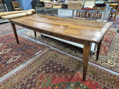 Lot 1273 - A French fruitwood refectory table, the...