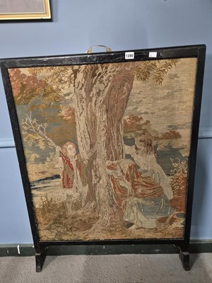 Lot 1280 - A Victorian needwork pictorial firescreen.