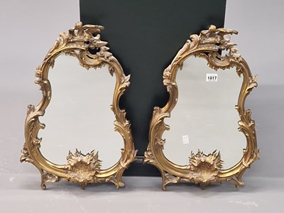 Lot 1017 - A pair of early 20th century mirrors in ormolu...