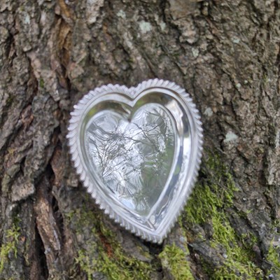 Lot 2 - A small token, shaped simply as a heart. This...