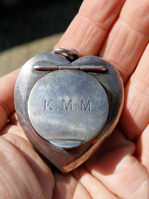 Lot 30 - This heart-shaped silver piece is engraved to...