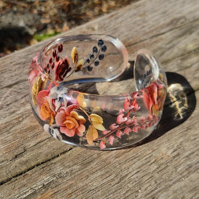 Lot 72 - A vintage clear cuff bangle, decorated with...