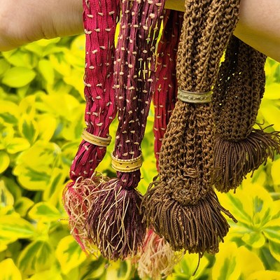 Lot 61 - A group of three Victorian misers purse, each...