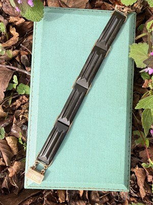 Lot 46 - An Art Deco bracelet, formed with four,...